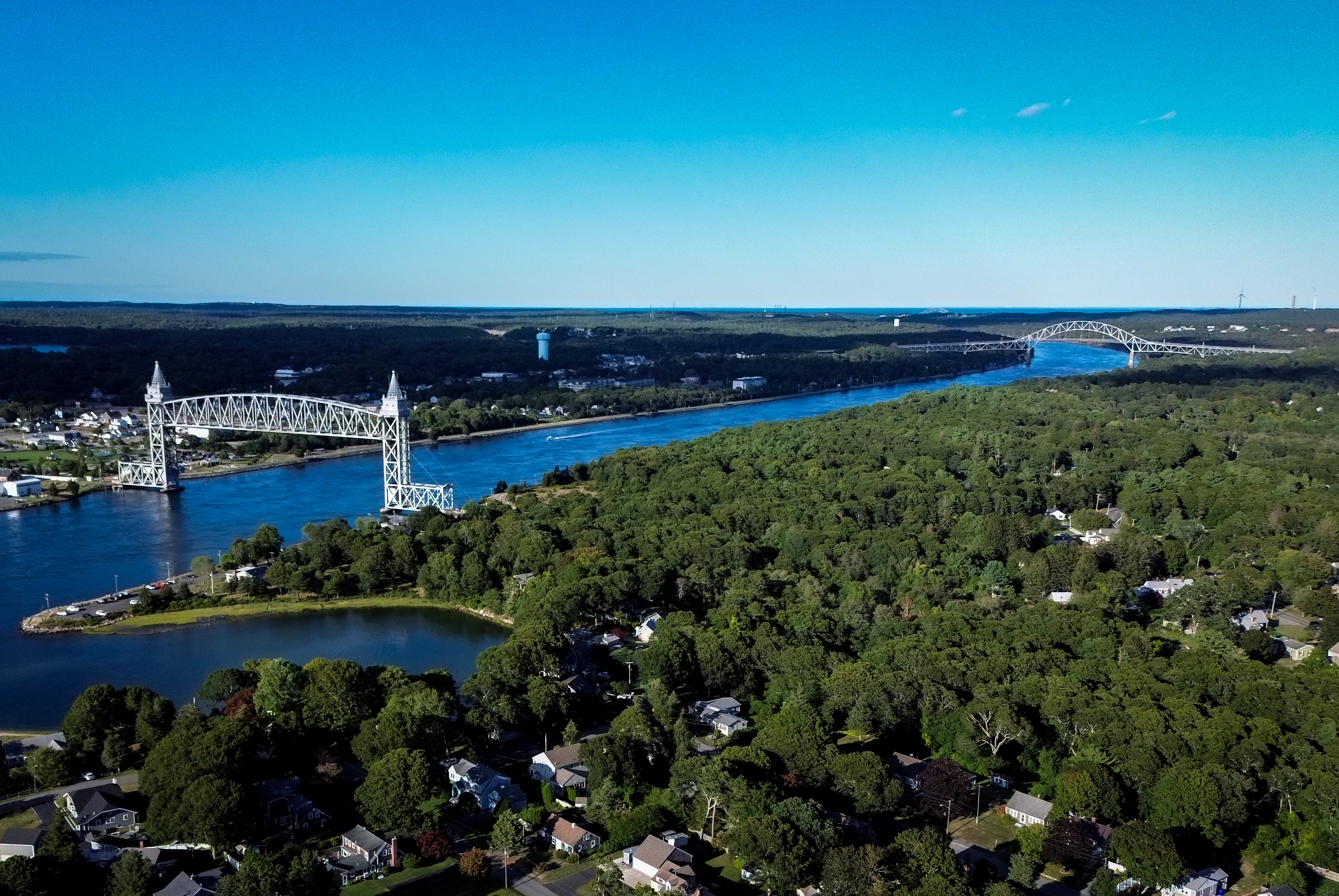 Aerial drone shot of the Cape Cod Canal with railroad and highway bridges